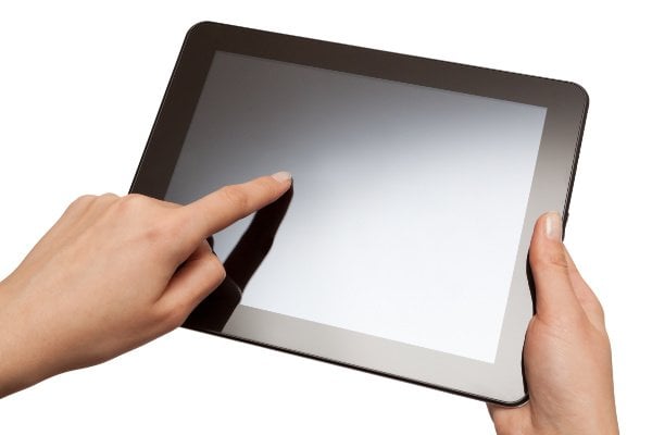 hands holding a tablet with isolated screen